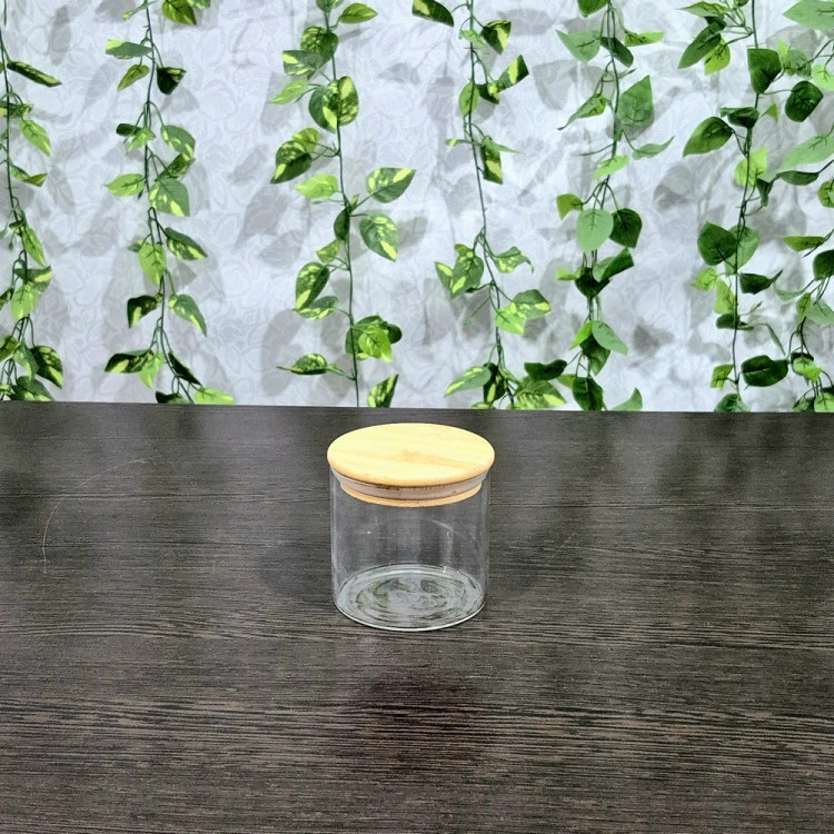 بانکه پیرکس گرد درب بامبو قطر ۸/۵ ارتفاع ۸،۱۰،۱۲،۱۵ و ۲۰ سانتیمتر Round Pyrex Storage Jar with Bamboo Lid — Diameter 8.5 cm, Heights 8, 10, 12, 15, and 20 cm
