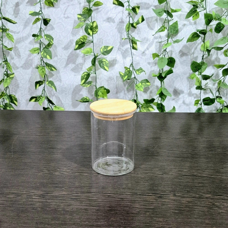بانکه پیرکس گرد درب بامبو قطر ۸/۵ ارتفاع ۸،۱۰،۱۲،۱۵ و ۲۰ سانتیمتر Round Pyrex Storage Jar with Bamboo Lid — Diameter 8.5 cm, Heights 8, 10, 12, 15, and 20 cm