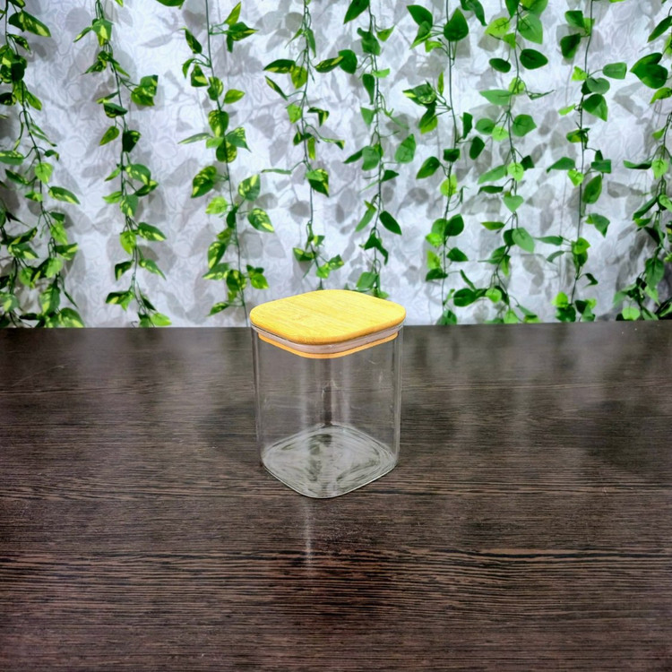 بانکه پیرکس مربعی ساده درب بامبو ابعاد کف ۱۰×۱۰ ارتفاع ۱۰،۱۵ و ۲۰ سانتی متر Simple Square Pyrex Storage Jar with Bamboo Lid — Base 10×10 cm, Heights 10, 15, and 20 cm